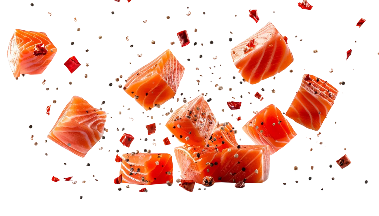 Floating Seasoned Salmon Cubes on Black Background - Free PNG