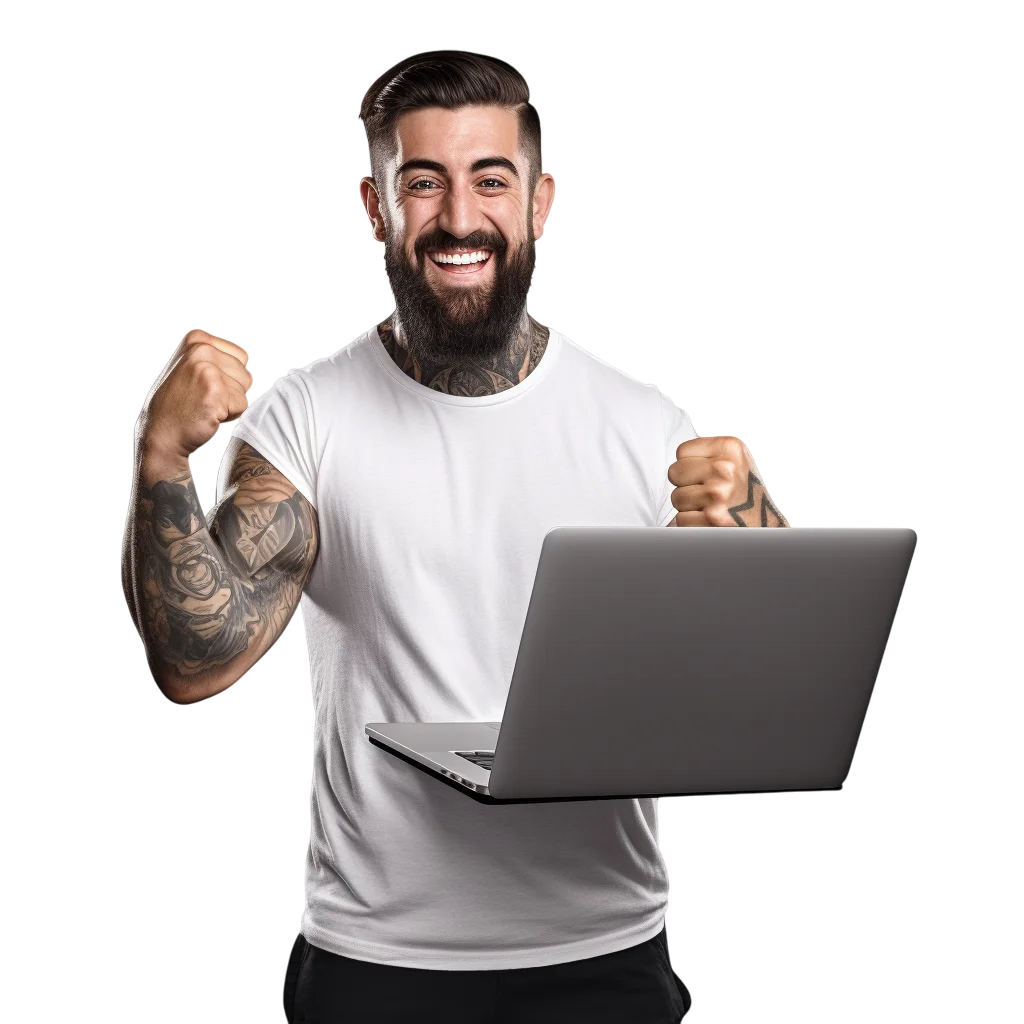 Smiling Tattooed Man Celebrating Behind Laptop Free PNG